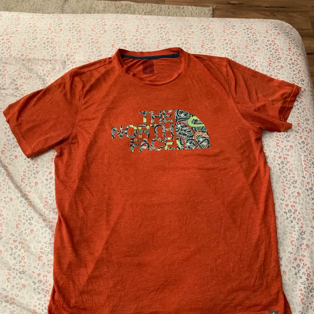 The North Face Orange Short Sleeve Tee with Nature-Inspired Design